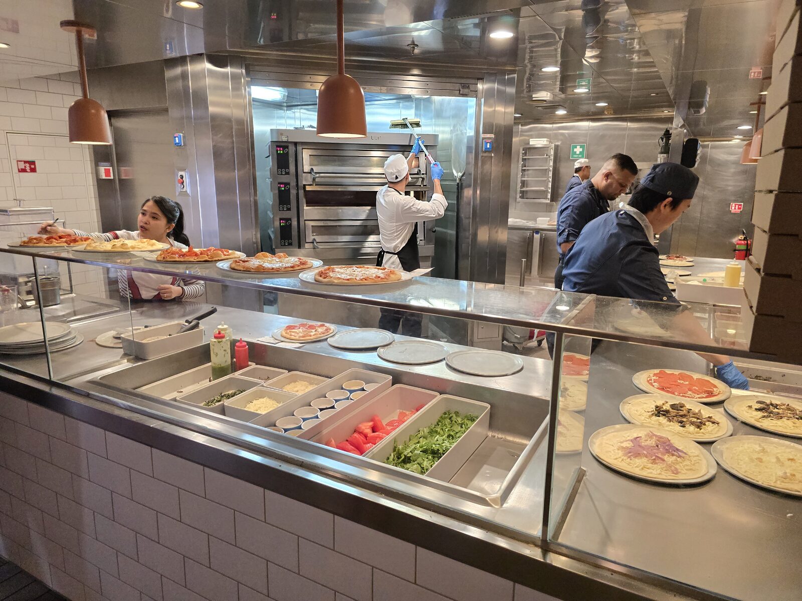 Pizzas being made at Pizza Place on Virgin Voyages